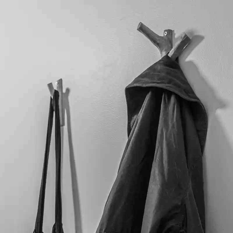 an image of 2 coat hooks made with tree branches